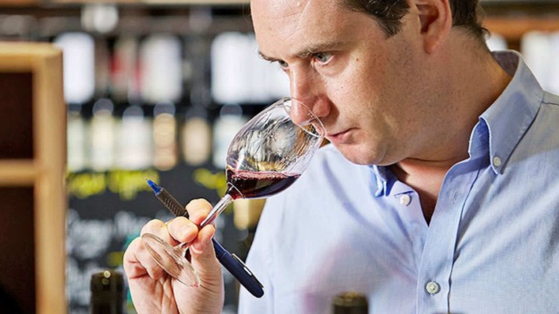 a man tasting wine showing tips to taste wine