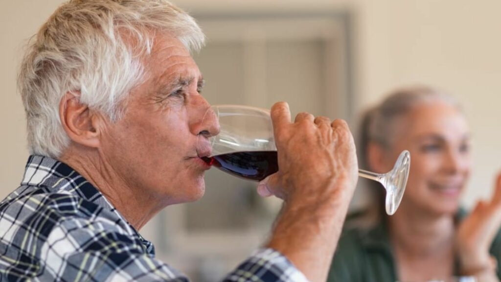 an old man tasting wine showing the tips to taste wine like a pro